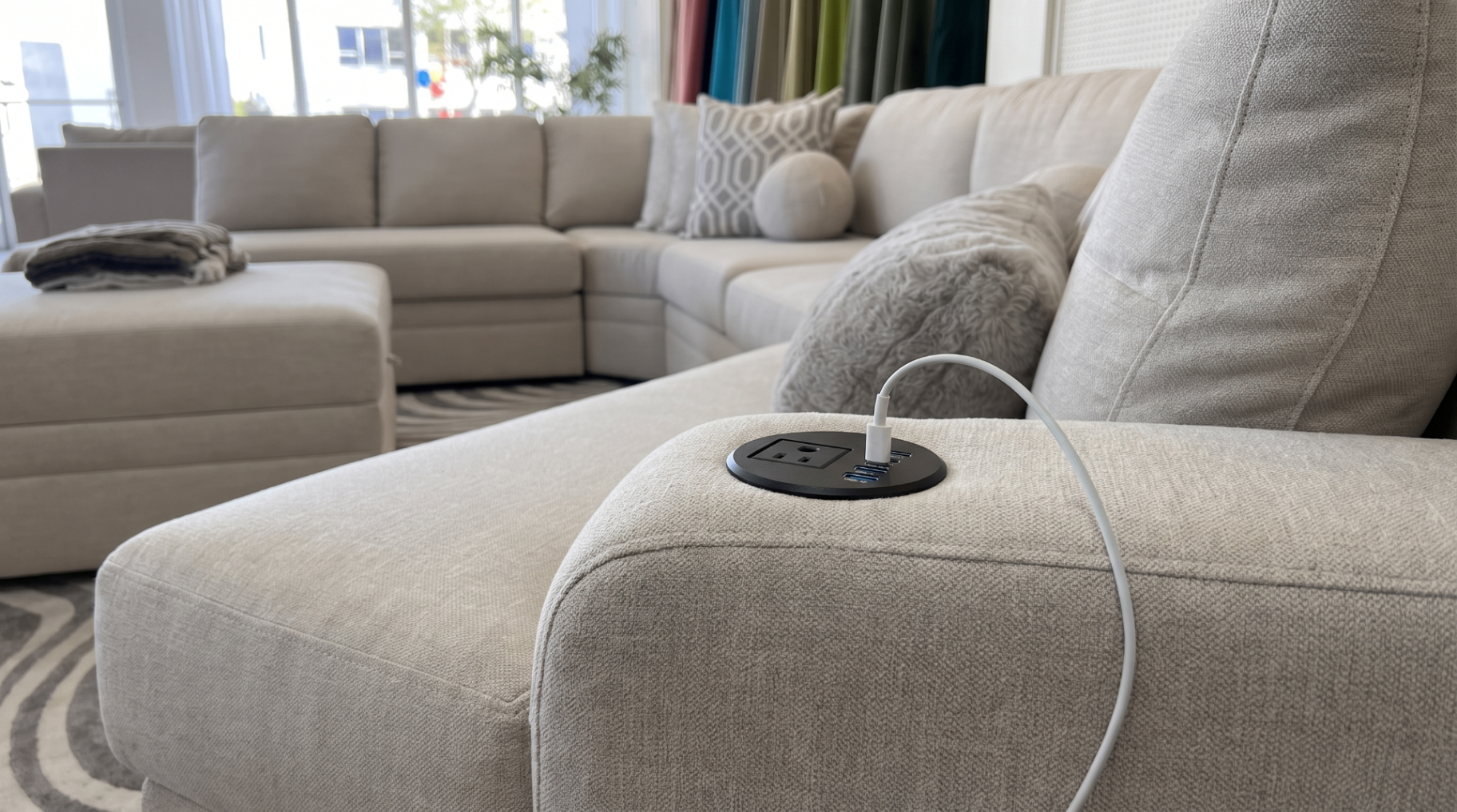 Carson sectional arm with built-in USB charging ports and outlet